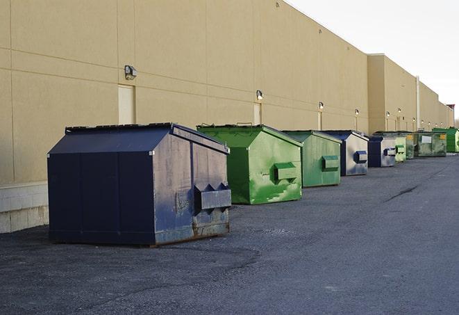 a row of industrial dumpsters at a construction site in Belvedere